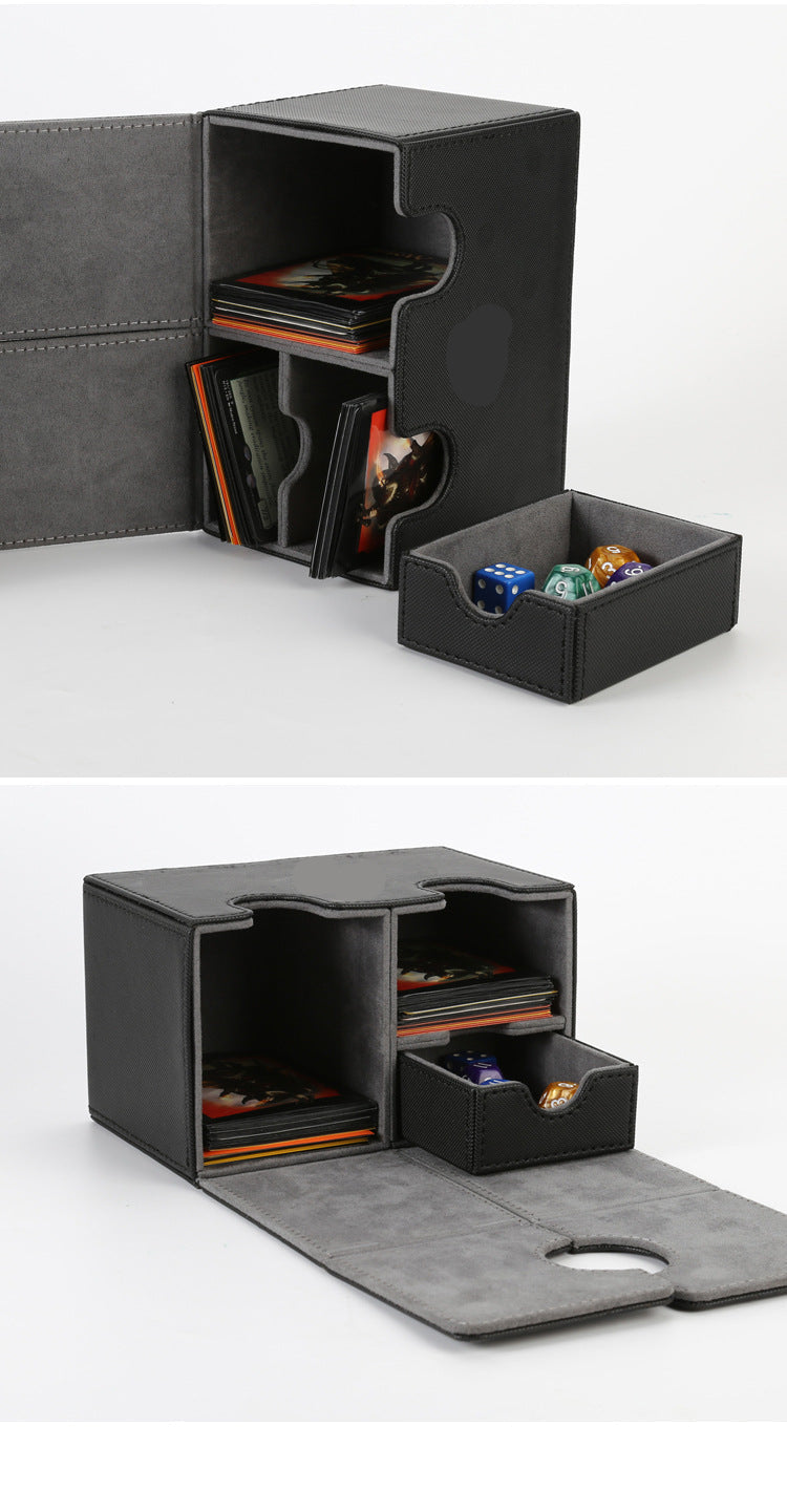 Black gaming organizer with compartments for cards and dice on a white background