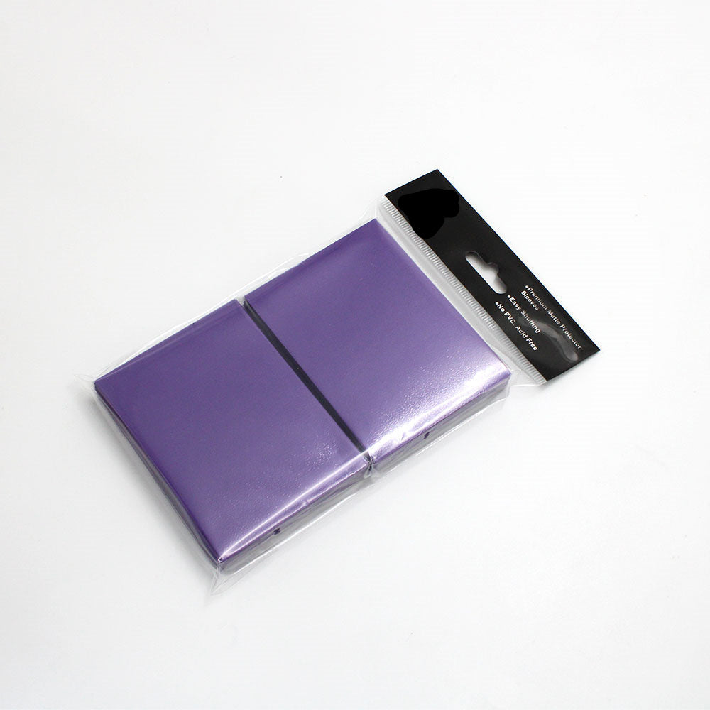 Purple compact mirror with black packaging on a white background
